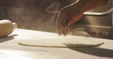 hand of italian chef make pasta for pizza or fresh egg pasta old tradition in extreme macro super slow motion