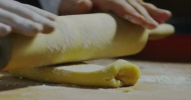 chef using in extreme slow motion rolling pin for traditional italian old recipe