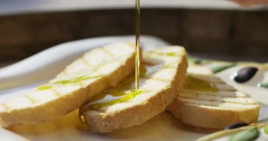 professional chef in extreme slow motion  use traditional oil for recipe of italian bread in extreme slow motion close up