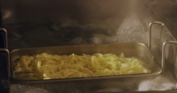 A expert chef working with ingredients in kitchen in extreme slow motion the best pasta original recipe with tomato yellow sauce — 图库视频影像