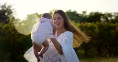beautiful little girl about two years immersed in nature , dressed clean try to make