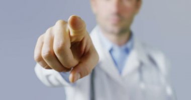 Doctor indicates technological gestures of classic neutral clean and dress charming environment