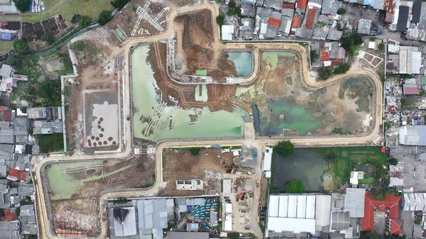 aerial view of a construction site with a large building