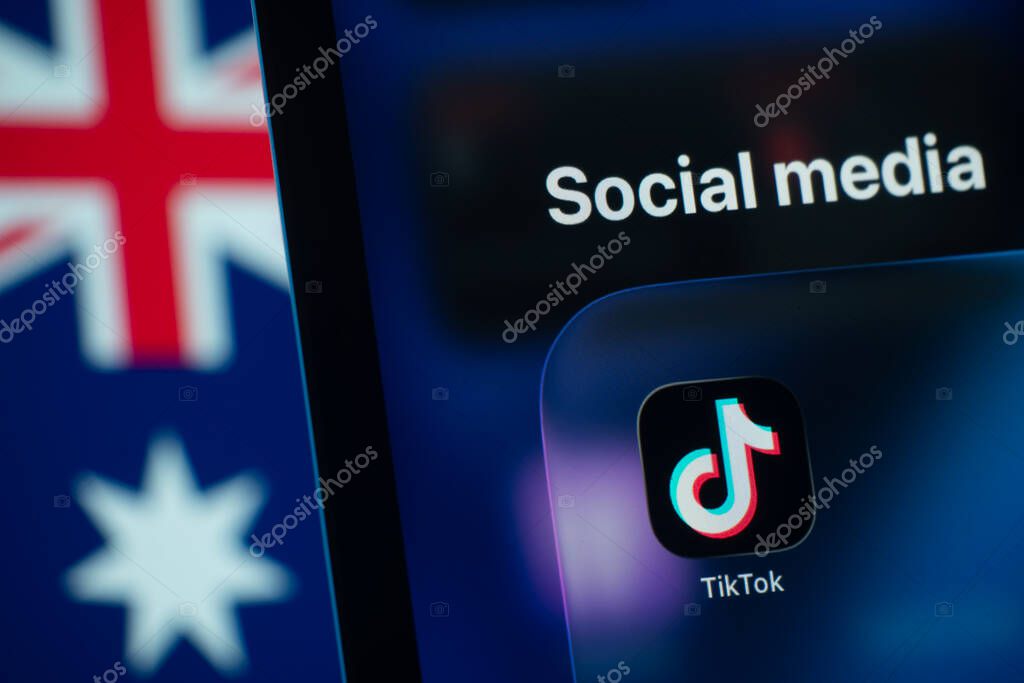 Dhaka, Bangladesh- 01 Dec 2025: A smartphone screen displays the Tiktok app with an Australian flag in the background.