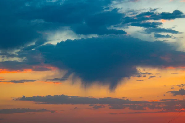 Dawn sky. Rain is gathering from the cloud. Red sky.