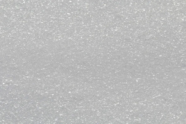 Winter snow. Snow texture Top view of the snow. Texture design. Snowy white texture. Snowflakes.