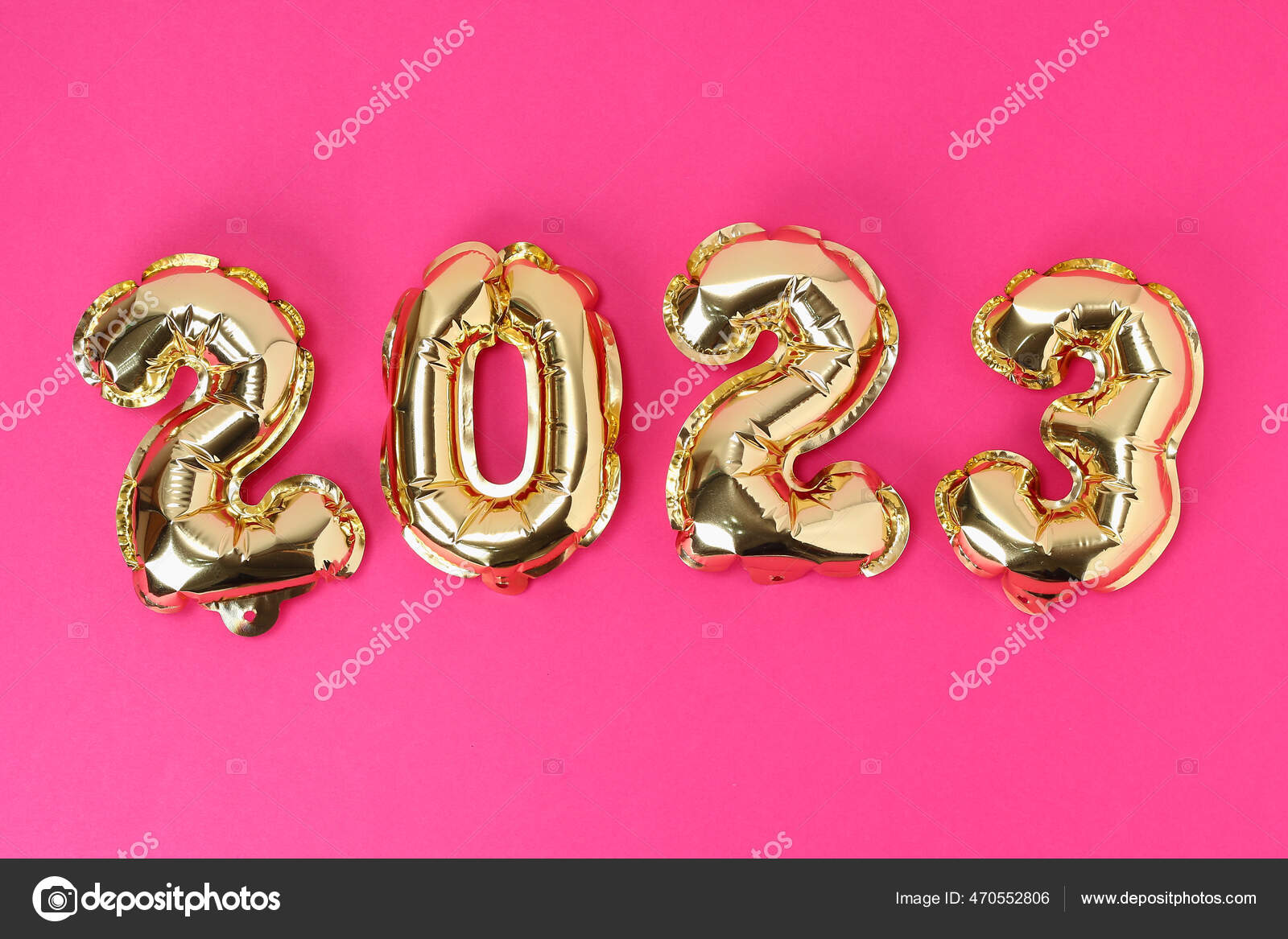 New Year 2023. Foil balloons numbers 2023 on pink background. New Year