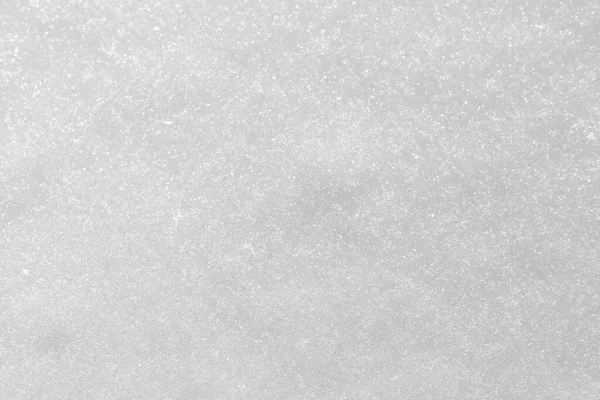 Winterschnee. Schneebeschaffenheit Draufsicht auf den Schnee. Texturgestaltung. Schneeweiße Textur. Schneeflocken. — Stockfoto