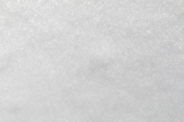 Vintersnö. Snö struktur Ovanifrån av snön. Konsistensdesign. Snövit konsistens. Snöflingor. — Stockfoto