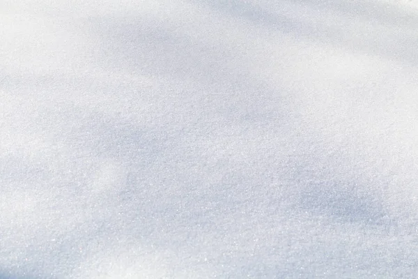 Winterschnee. Schneebeschaffenheit Draufsicht auf den Schnee. Texturgestaltung. Schneeweiße Textur. Schneeflocken. — Stockfoto