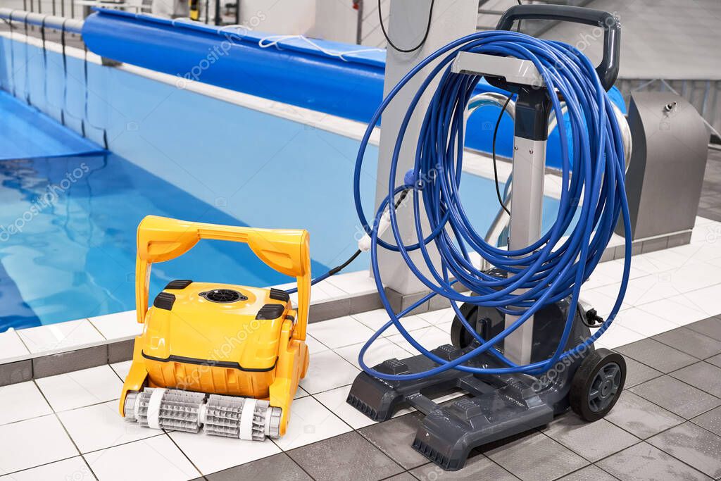 Yellow Robotic Pool Cleaner blue water pool cover