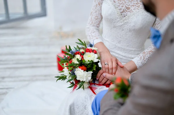 Beautiful wedding bouquet of pink and white peony flowers in hands of the bride — Stock Photo, Image