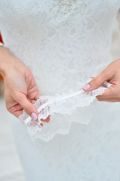 Lace garter in a hands — Stock Photo, Image