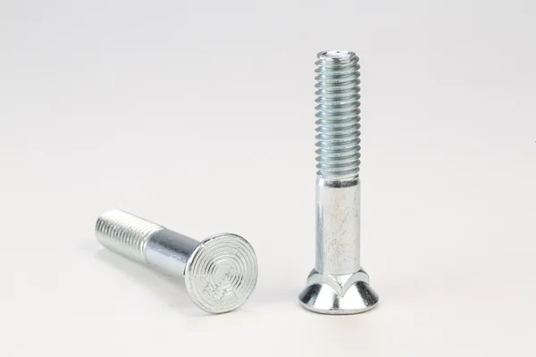 Bolts and screws on a white background — Stock Photo, Image