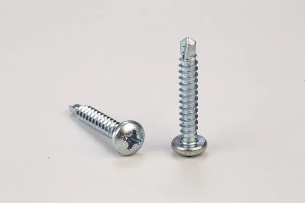 Bolts and screws on a white background — Stock Photo, Image