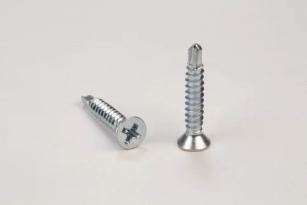 Bolts and screws on a white background — Stock Photo, Image