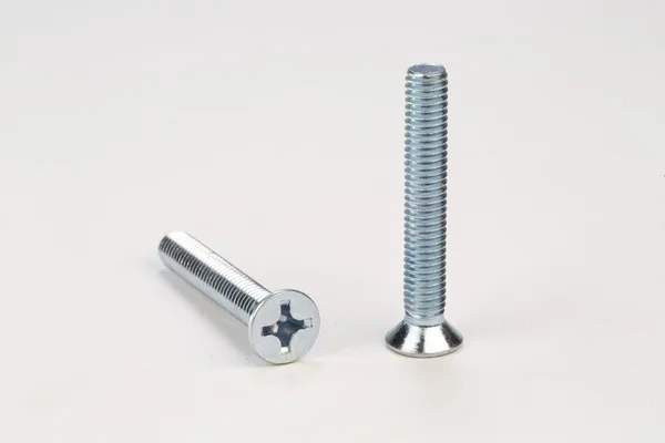 Bolts and screws on a white background — Stock Photo, Image