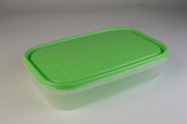 Plastic box with colorful lid — Stock Photo, Image