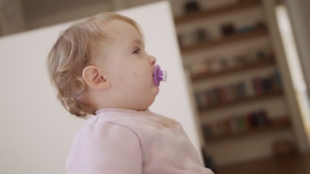 Cute baby playing at home and smiling to the camera — Stock Video