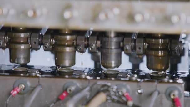 Close up of a punch press forming metal part in a production line — Stok Video
