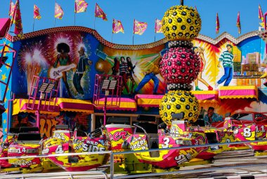 St Veit An Der Glan, Austria - October 03, 2025: Amusement park ride at St. Veiter Wiesenmarkt, showcasing bright colors and festive decorations, creating a joyful ambiance