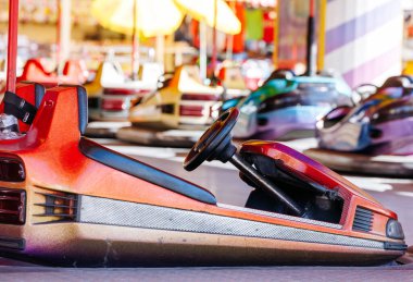St Veit An Der Glan, Austria - October 03, 2025: Colorful bumper car at St. Veiter Wiesenmarkt, highlighting its vibrant design and playful ambiance with copy space