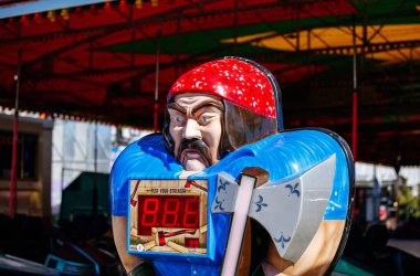 St Veit An Der Glan, Austria - October 03, 2025: Vibrant strongman game at St. Veiter Wiesenmarkt, featuring colorful design and strength measurement display