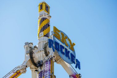 St Veit An Der Glan, Austria - October 03, 2025: Sky Wheel ride at St. Veiter Wiesenmarkt features bright colors and exciting design under a clear sky