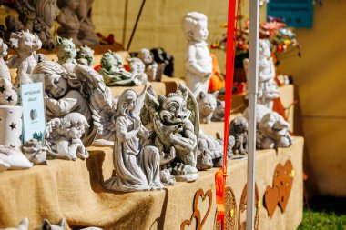 St Veit An Der Glan, Austria - October 03, 2025: Decorative ceramic sculptures are showcased at St. Veiter Wiesenmarkt, highlighting artistic details and vibrant colors