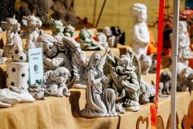 St Veit An Der Glan, Austria - October 03, 2025: Decorative sculptures are showcased at St. Veiter Wiesenmarkt, featuring unique designs and textures in a lively market setting