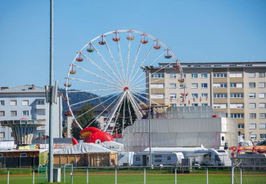 St Veit An Der Glan, Austria - October 03, 2025: St. Veiter Wiesenmarkt displays a large Ferris wheel and lively attractions, capturing the essence of the fair