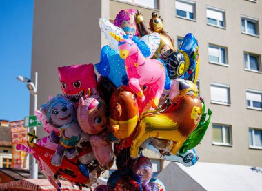 St Veit An Der Glan, Austria - October 03, 2025: Colorful balloons shaped like popular cartoon characters at St. Veiter Wiesenmarkt, creating a joyful ambiance