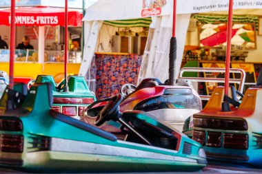 St Veit An Der Glan, Austria - October 03, 2025: Bumper cars at St. Veiter Wiesenmarkt, featuring bright colors and playful designs, creating a lively fair ambiance