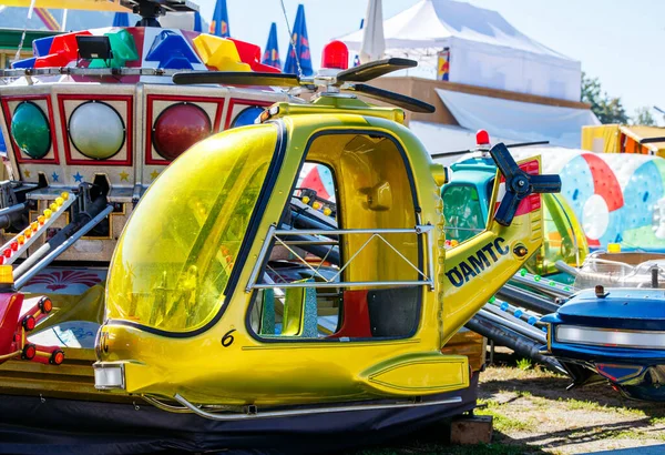 St Veit An Der Glan, Austria - October 03, 2025: Amusement park helicopter ride at St. Veiter Wiesenmarkt, featuring bright colors and inviting design for children