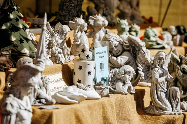 St Veit An Der Glan, Austria - October 03, 2025: Decorative figurines are beautifully arranged at St. Veiter Wiesenmarkt, highlighting craftsmanship and artistic details