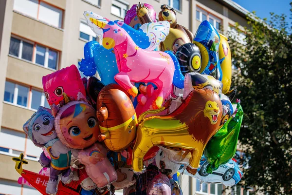 St Veit An Der Glan, Austria - October 03, 2025: Vibrant collection of character balloons at St. Veiter Wiesenmarkt, creating a lively and cheerful scene
