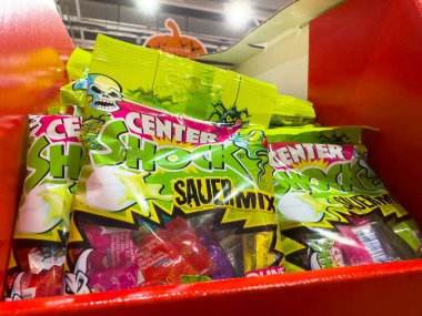 Villach, Austria - October 09, 2025: Center Shock sour candy bags are prominently displayed in a retail environment, featuring bright colors and enticing designs