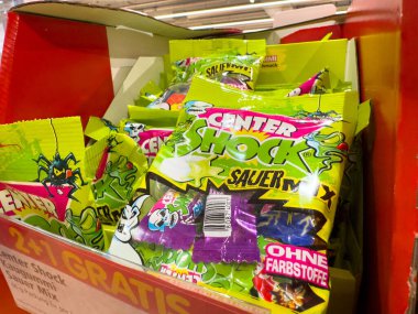 Villach, Austria - October 09, 2025: Center Shock sour candy bags are arranged in a bright box, highlighting their fun flavors and playful packaging design