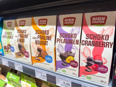 Villach, Austria - October 09, 2025: Colorful Rosen Garten chocolate boxes are arranged on a supermarket shelf, highlighting diverse flavors and attractive packaging