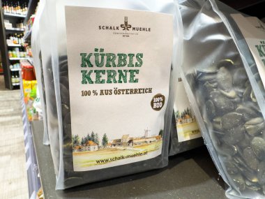 Villach, Austria - October 09, 2025: Packaged organic Kurbis Kerne from Schalk Muhle displayed in grocery store, highlighting freshness and local sourcing