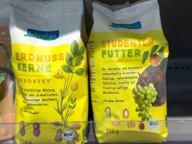 Villach, Austria - October 09, 2025: Reformhaus Erdnukerne and Studentenfutter packages on shelf, highlighting nutritious snacks for health-conscious consumers