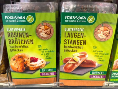 Villach, Austria - October 09, 2025: Poensgen gluten-free baked goods packaging displays Rosinen-Brotchen and Laugen-Stangen, appealing to health-conscious snack lovers