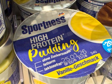 Villach, Austria - October 09, 2025: Sportness high protein pudding displayed in store, featuring bright packaging and delicious vanilla flavor, ideal for health enthusiasts