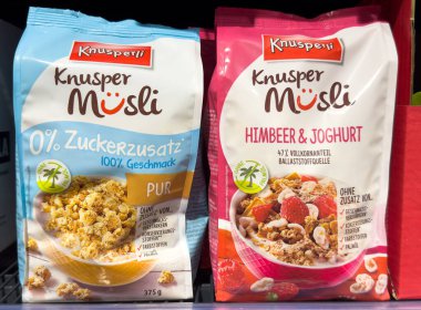 Villach, Austria - October 09, 2025: Knusperli Muslis are showcased on a supermarket shelf, highlighting flavors with colorful packaging and enticing visuals