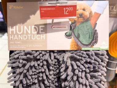 Villach, Austria - October 09, 2025: Tchibo dog towel on display, designed with textured fibers for drying pets effectively, ideal for pet owners in retail setting