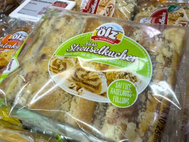 Villach, Austria - October 09, 2025: Olz Streuselkuchen pastry package displays nut-filled cake with appealing textures and vibrant branding, perfect for dessert lovers