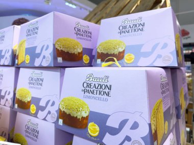 Villach, Austria - October 09, 2025: Bauli Limoncello panettone boxes are beautifully arranged in a vibrant display, highlighting the festive Italian dessert
