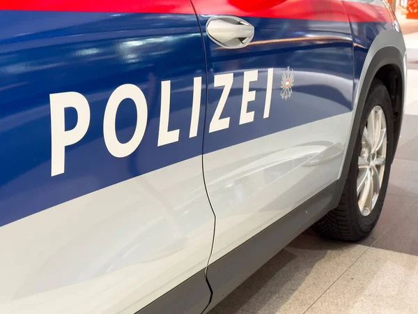 Villach, Austria - October 09, 2025: Polizei car features striking blue and red colors, parked in a contemporary setting, symbolizing security and community service
