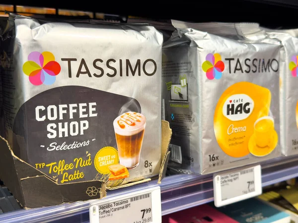 Villach, Austria - October 09, 2025: Tassimo coffee shop selections with toffee nut latte packaging displayed on supermarket shelf, highlighting colorful design and appealing product presentation