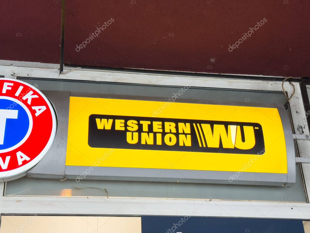 Ljubljana, Slovenia - October 10, 2025: Western Union sign is featured on storefront, highlighting brand colors and logo, perfect for financial service concepts